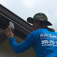 Technician Installing a Rain Gutter