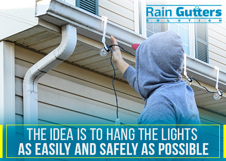 Man Hanging Christmas Lights