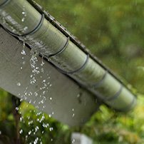 Filled rain gutter in winter