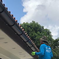 Technician installing a gutter system