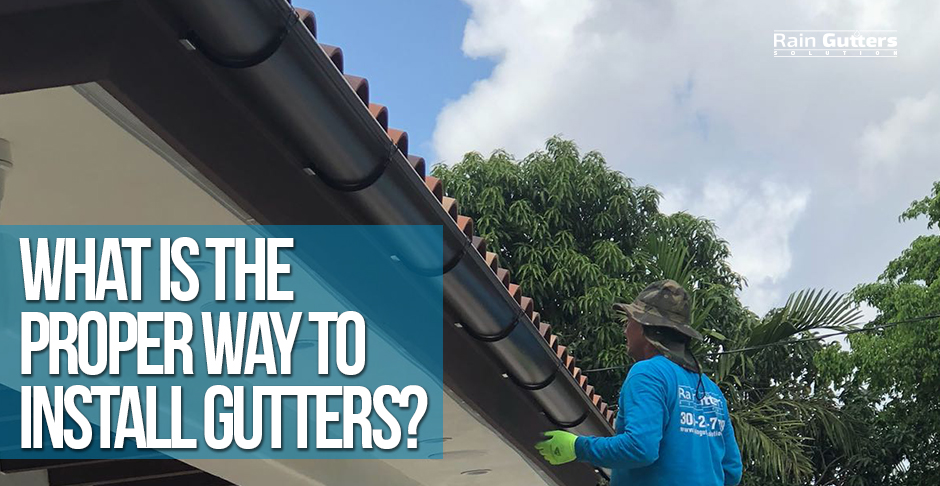 Technician installing rain gutters