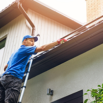 Man Installing Gutters Longer Than Roof
