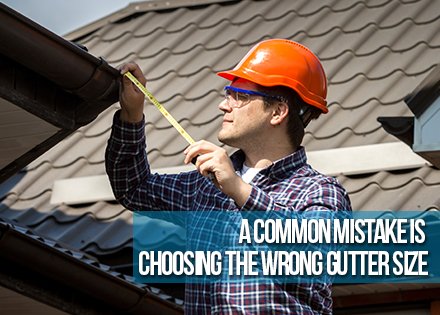 Homeowner Installing Gutters