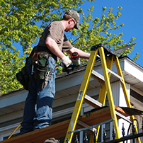 Man Installing DIY Gutters