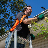 Man Installing DIY Rain Gutters