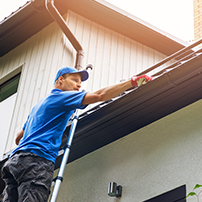 Man Cleaning Gutters