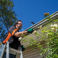 Man installing DIY gutters