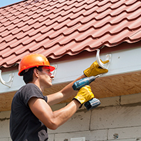 Man Installing Rain Gutters