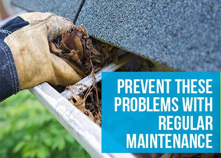 A Person Cleaning a Gutter by Removing Debris