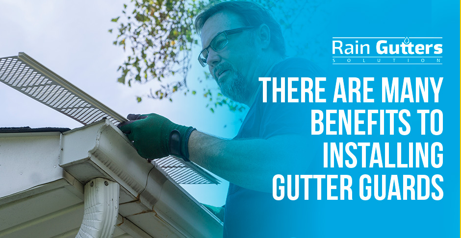 Technician Installing Metallic Mesh Gutter Guards