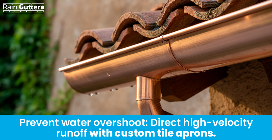 A macro architectural shot showing a custom copper half-round gutter fitted with an extended drip-edge apron tucking neatly beneath the lower edge of Spanish terracotta roof tiles.