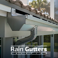 A detailed architectural close-up showing a heavy-gauge structural aluminum super-gutter acting as both the primary roof drainage channel and the support beam for a pool screen enclosure frame.