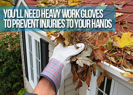 Man's Hand Cleaning a Rain Gutter