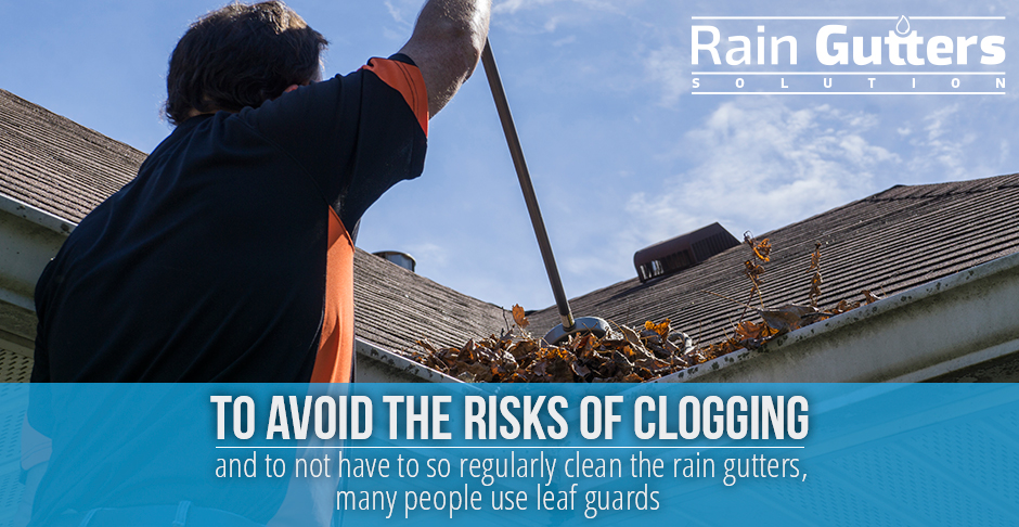 Installed Rain Gutters May Use Leaf Guards to Avoid Clogging Man cleaning a clogging rain gutter