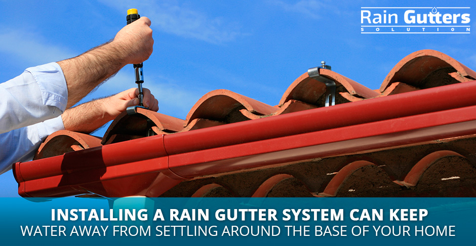 Man installing a rain gutter in a house 